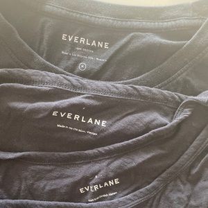 Three black everlane tee shirts